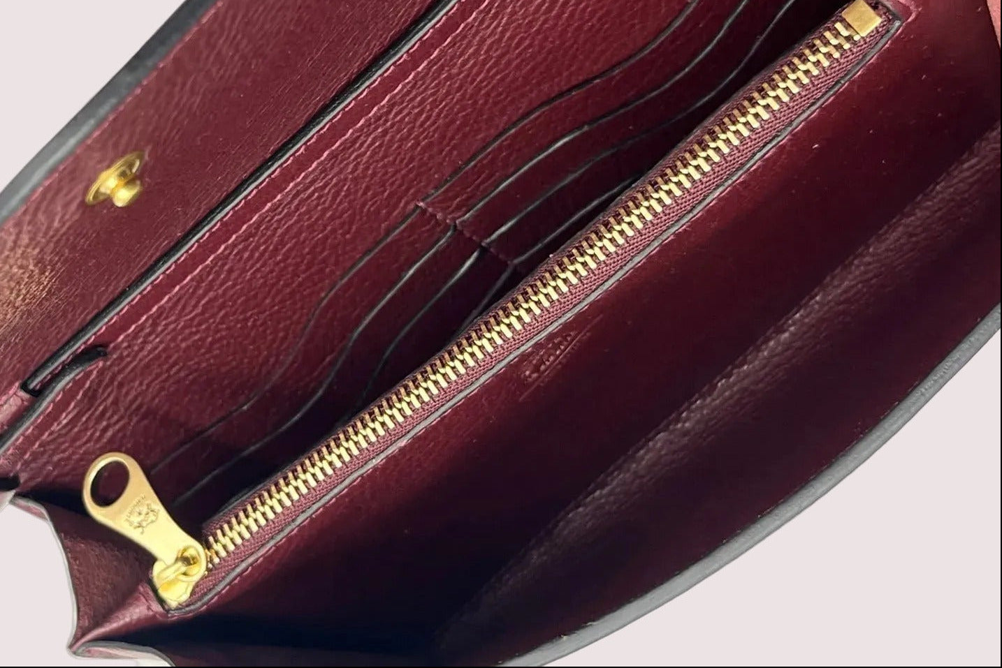Clutch zum Umhängen aus Naturleder in Bordeaux mit Innenfächern Taschen Clutches Il Bisonte